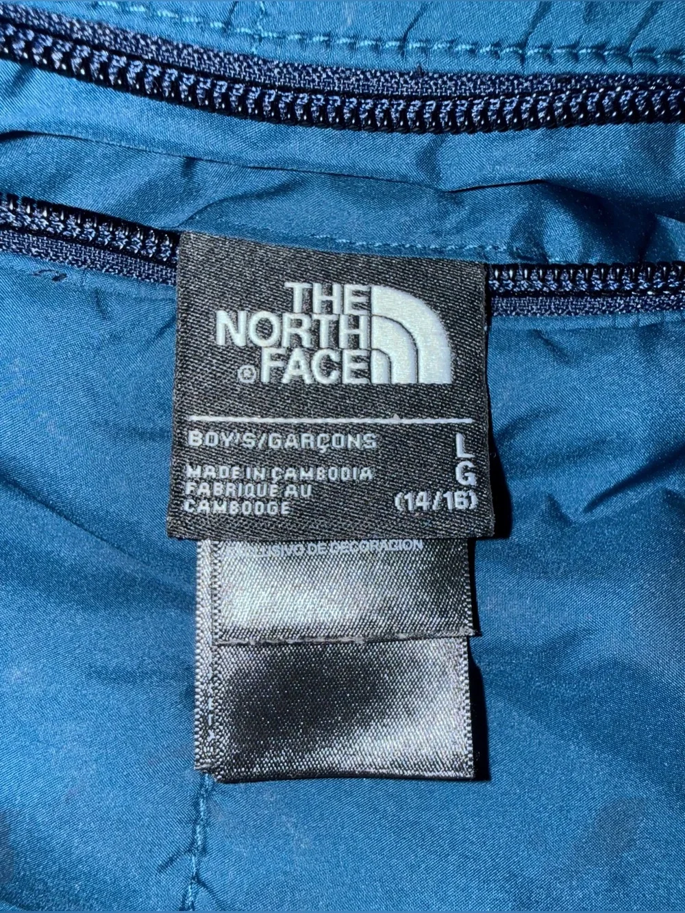 The North Face reversible puffer jacket with a soft, fleece lining, size 14/16